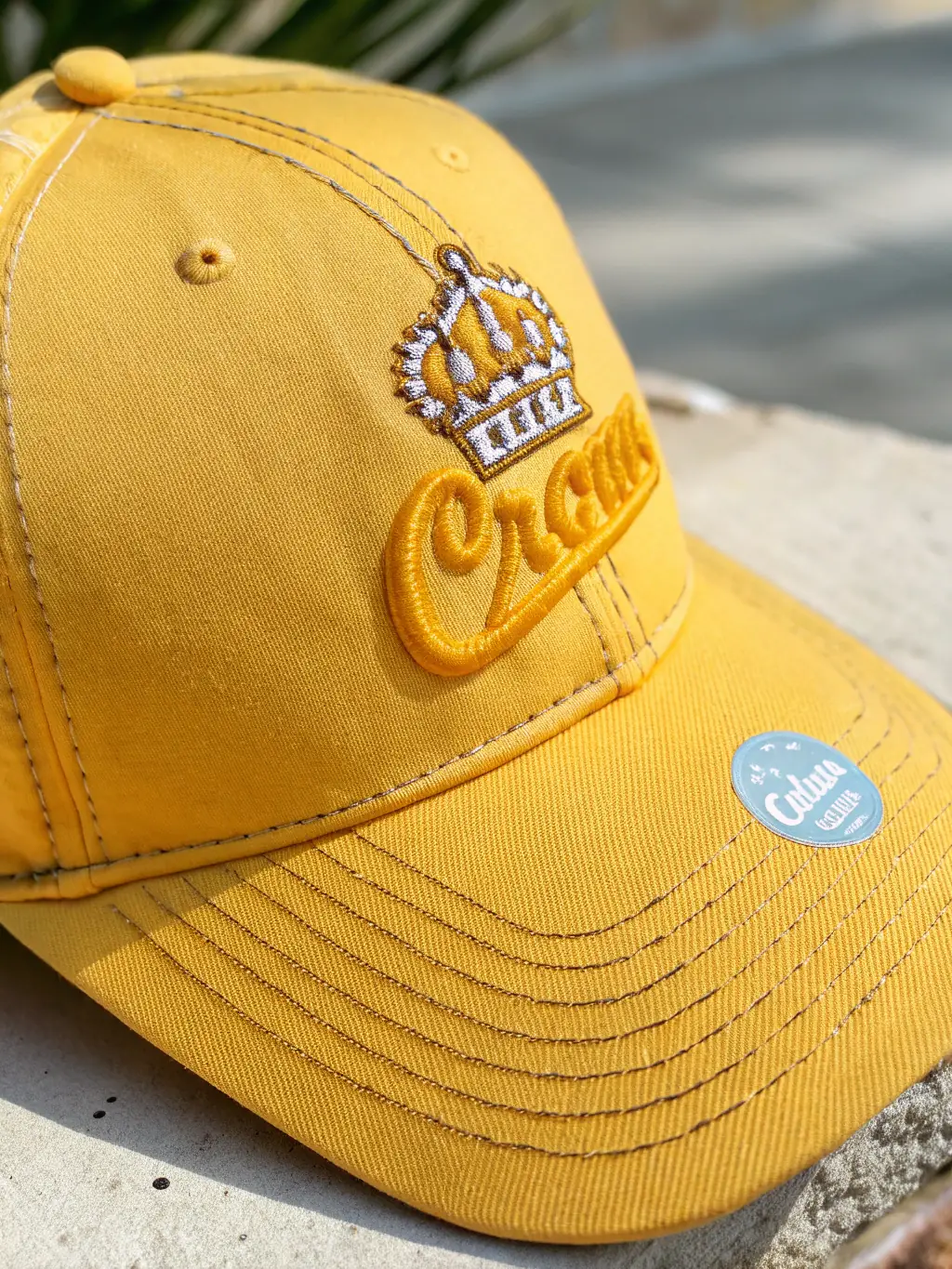 A close-up shot of a hat with an embroidered company logo, showcasing the precision and quality of the embroidery work.